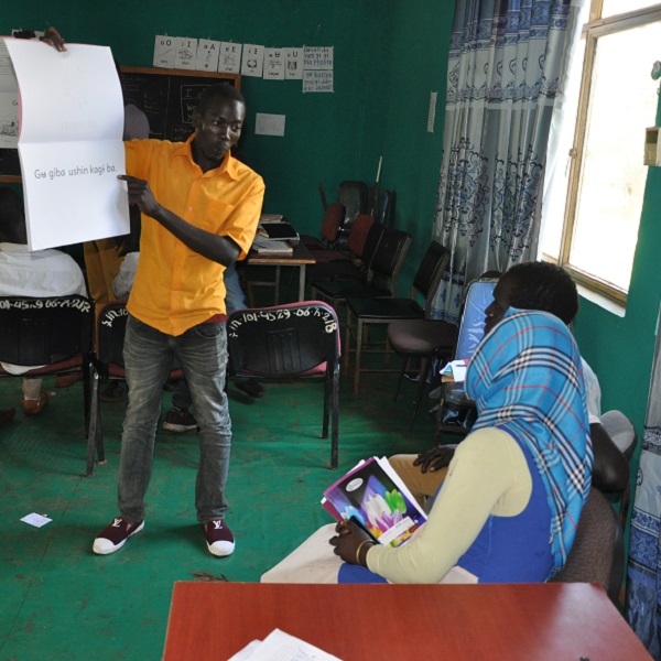Komo people learning to read