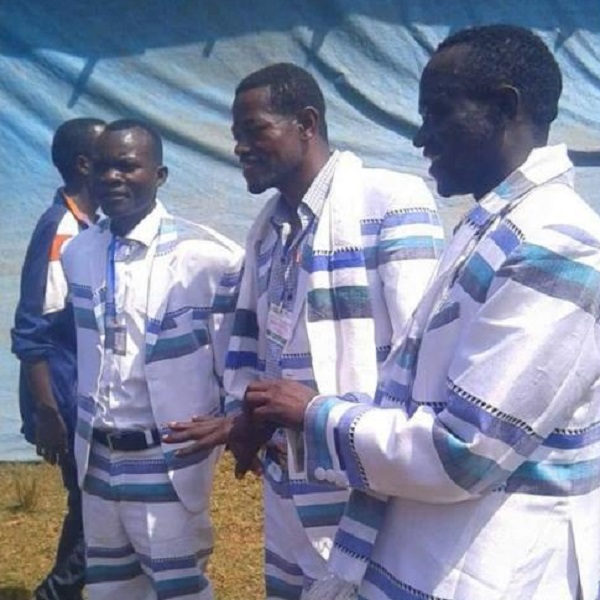 Me'en men wearing matching white clothes with blue stripes