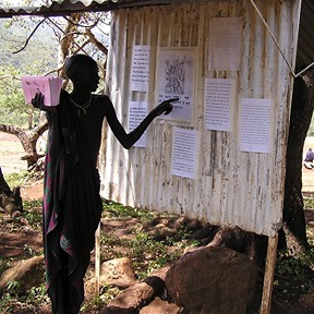 A student practices with a literacy board.